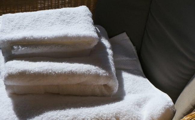 Professionally cleaned guest linens prepared for a Mikalli property.